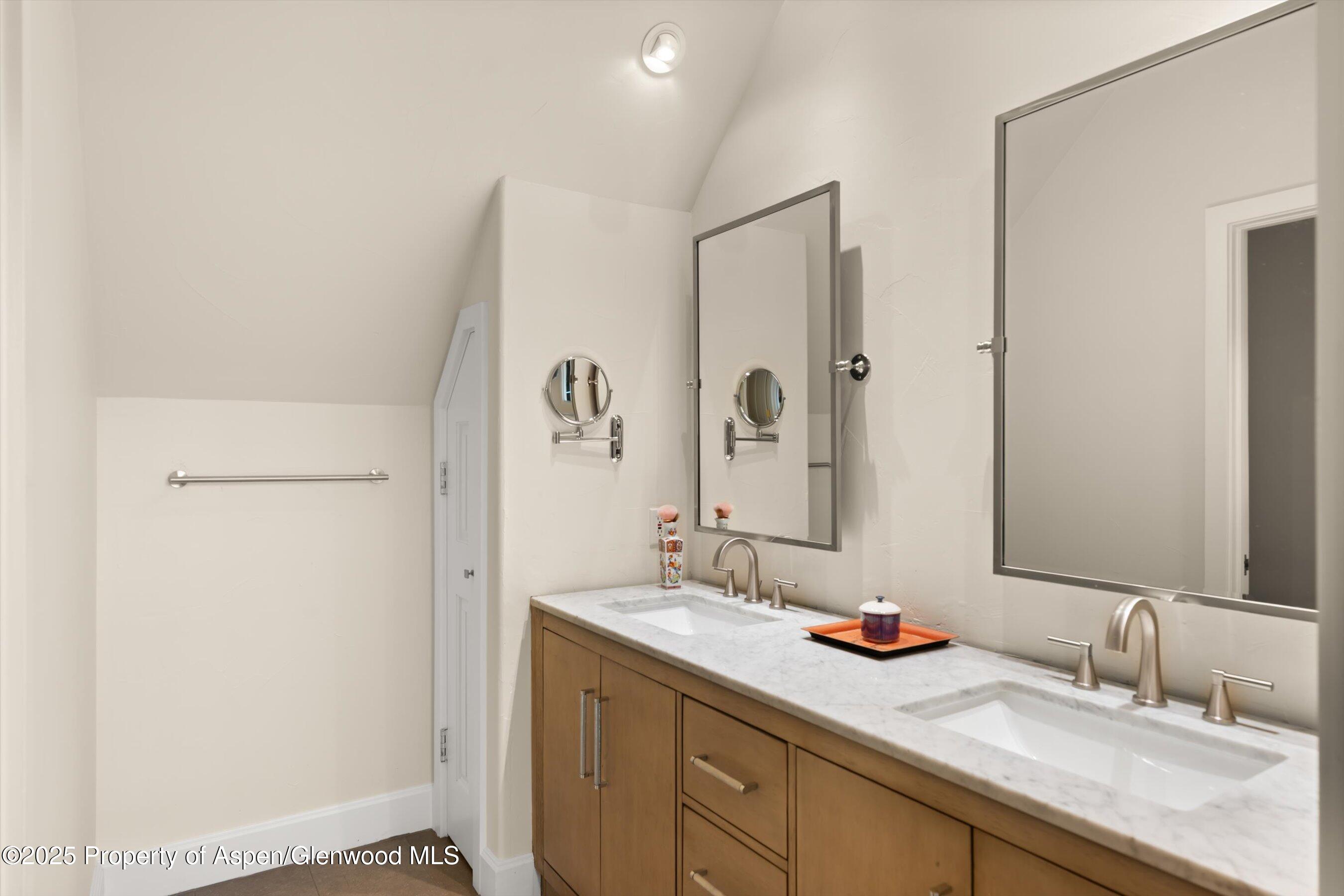 2240 Old Herron Road Basalt, CO 81621 - Photo 14 of 42 a bathroom with a double vanity sink and a mirror