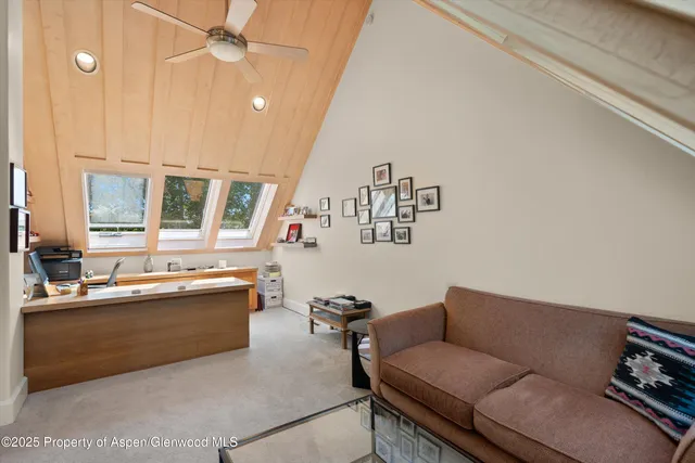 a living room with furniture and a rug