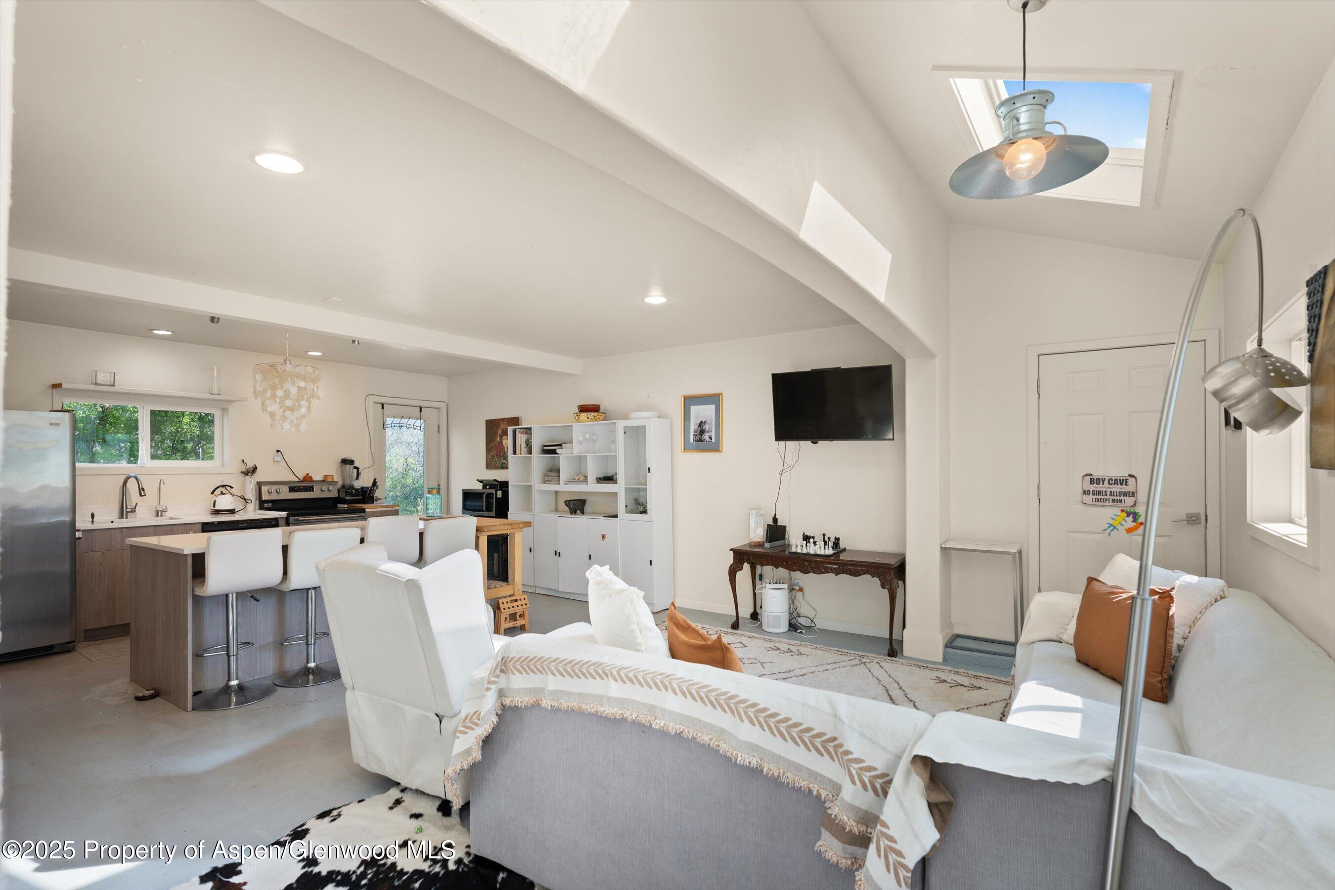 2240 Old Herron Road Basalt, CO 81621 - Photo 21 of 42 a living room with furniture and a flat screen tv