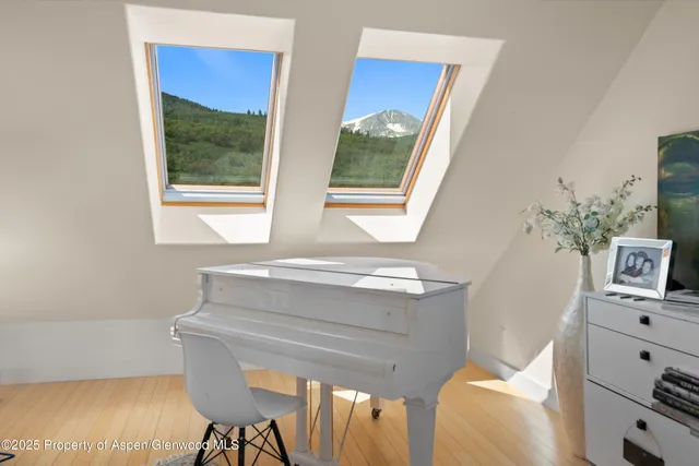 a spacious bedroom with a bed and a walk in closet