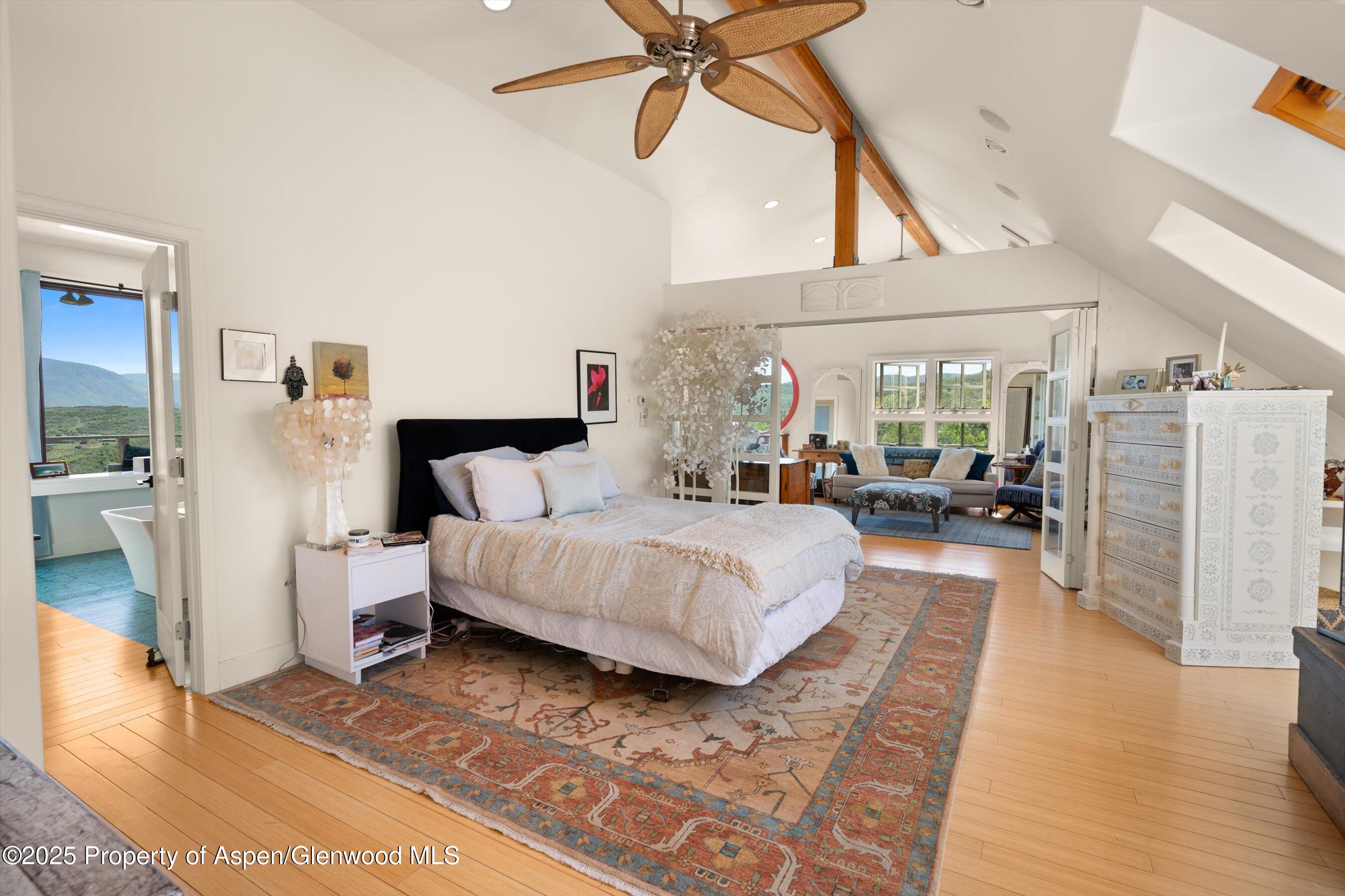2240 Old Herron Road Basalt, CO 81621 - Photo 32 of 42 a spacious bedroom with a bed and a walk in closet