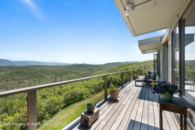 a house that has sitting area in backyard
