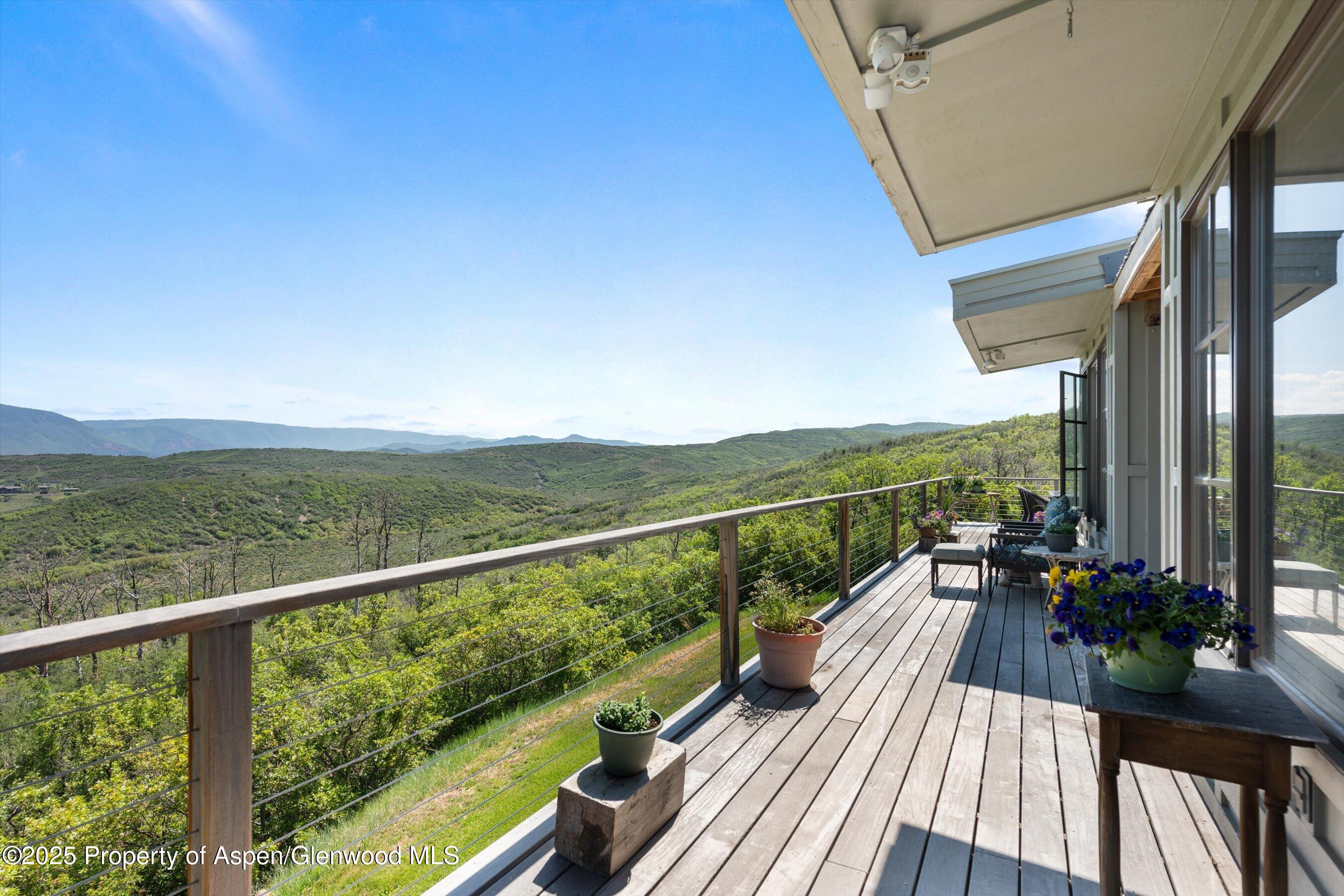 2240 Old Herron Road Basalt, CO 81621 - Photo 34 of 42 a view of balcony with mountain view and wooden floor