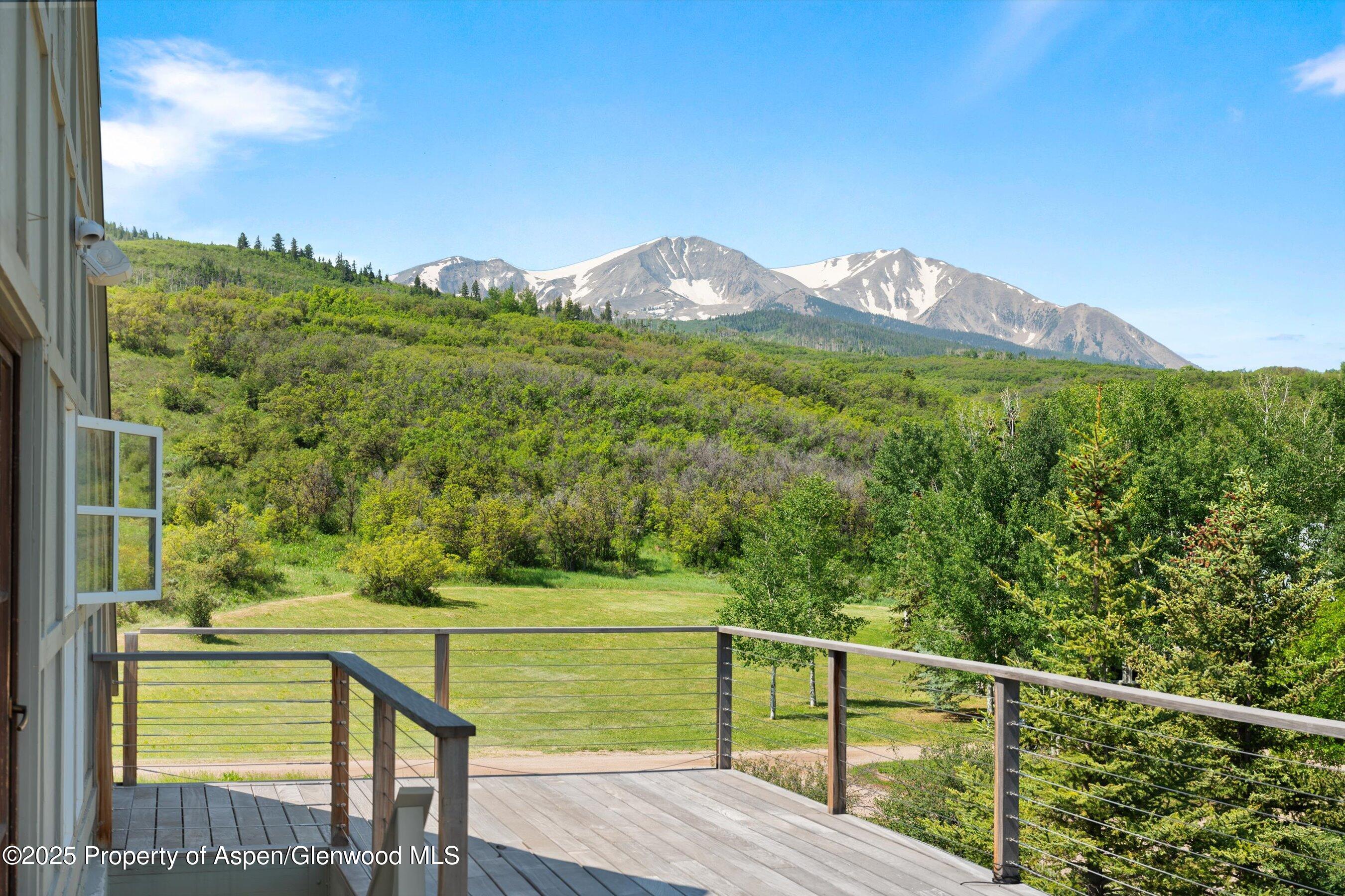 2240 Old Herron Road Basalt, CO 81621 - Photo 37 of 42 a view of a green field with mountains in the background