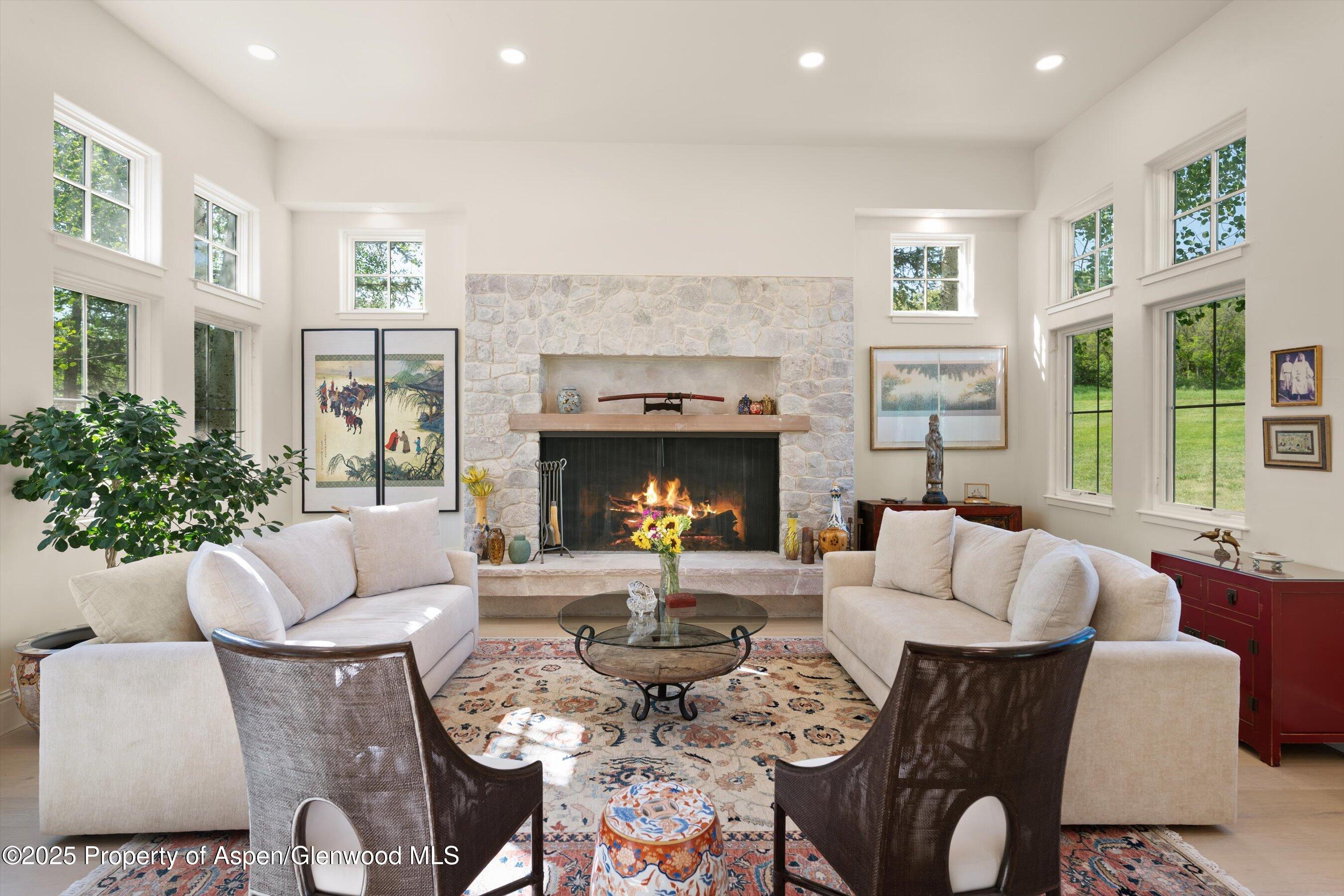 2240 Old Herron Road Basalt, CO 81621 - Photo 6 of 42 a living room with furniture large window and fireplace