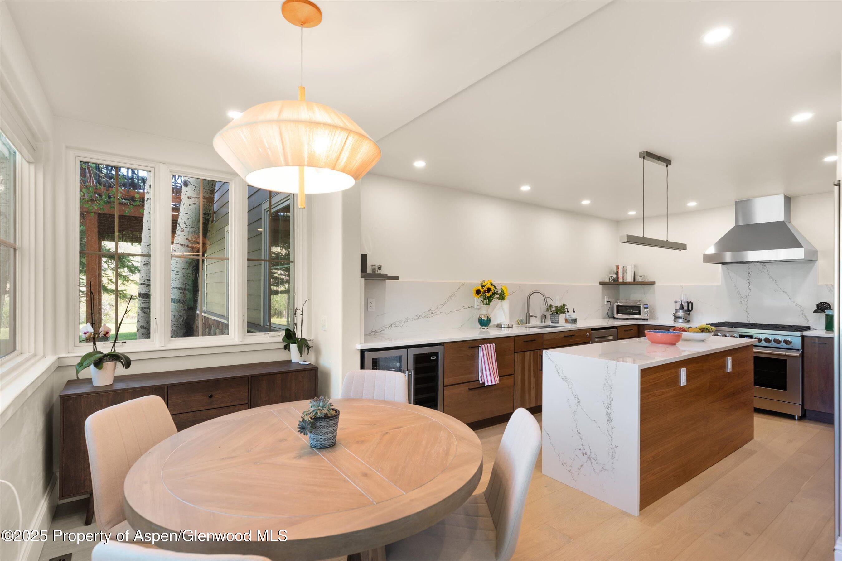 2240 Old Herron Road Basalt, CO 81621 - Photo 8 of 42 a kitchen with a dining table and chairs