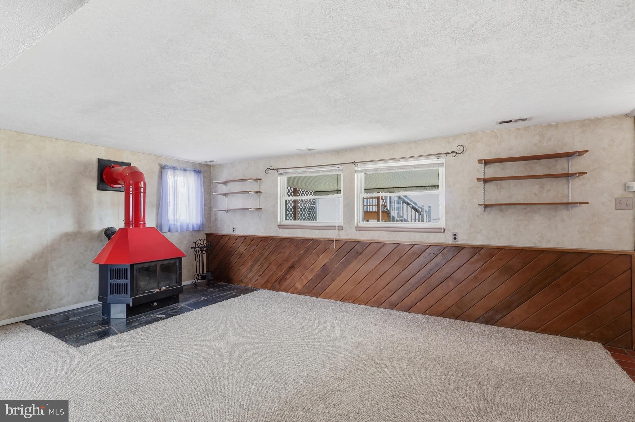 403 Byron Road Warminster, PA 18974 - Photo 37 of 76 Cozy Den features a wood-burning stove