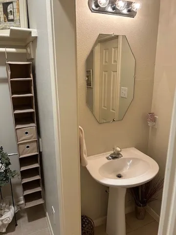 a bathroom with a sink a mirror and a toilet