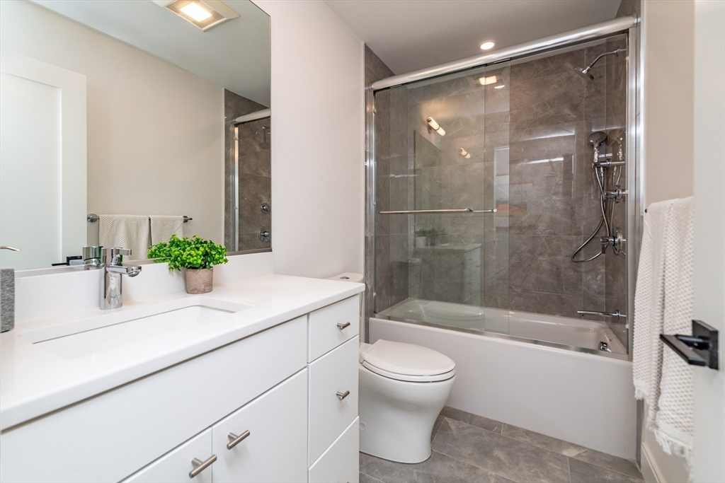 281 Lamartine Street Boston, MA 02130 - Photo 11 of 14 a bathroom with a sink a toilet and shower