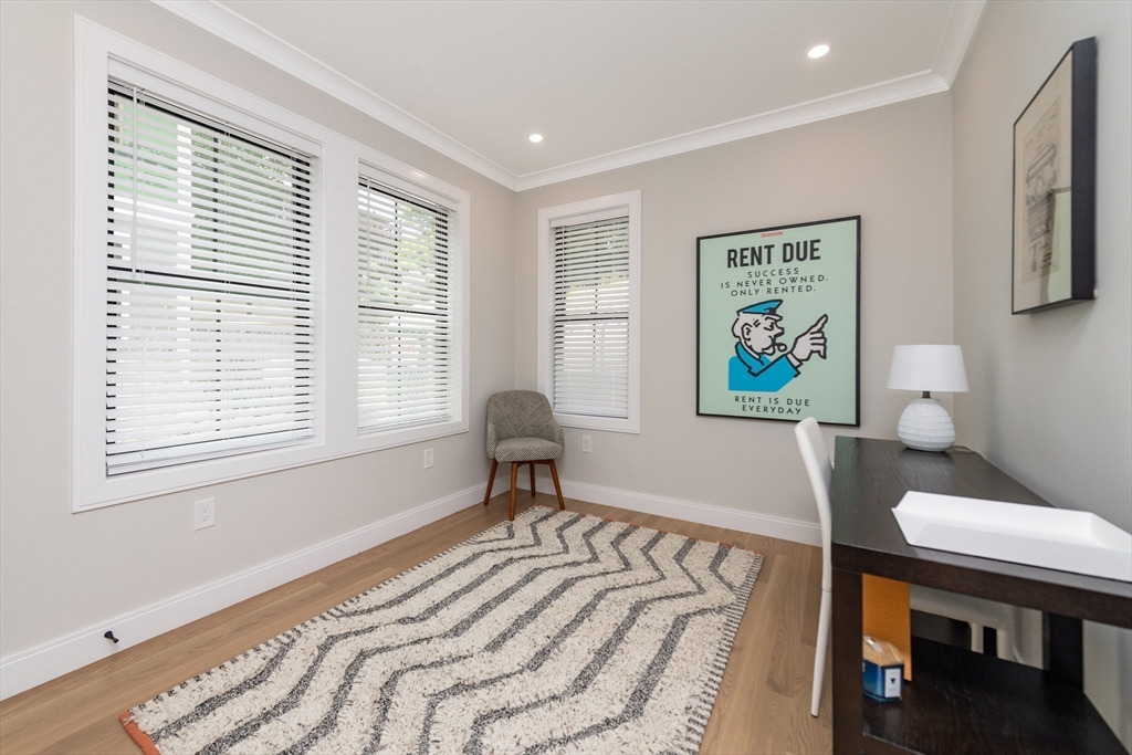 281 Lamartine Street Boston, MA 02130 - Photo 12 of 14 a bedroom with a bed and a window