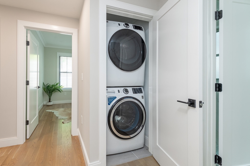 281 Lamartine Street Boston, MA 02130 - Photo 13 of 14 a view of a hallway with washer and dryer