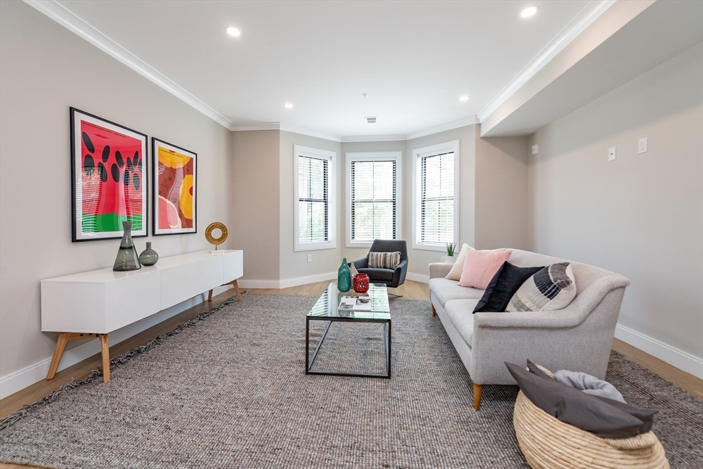 281 Lamartine Street Boston, MA 02130 - Photo 2 of 14 a living room with furniture and a window