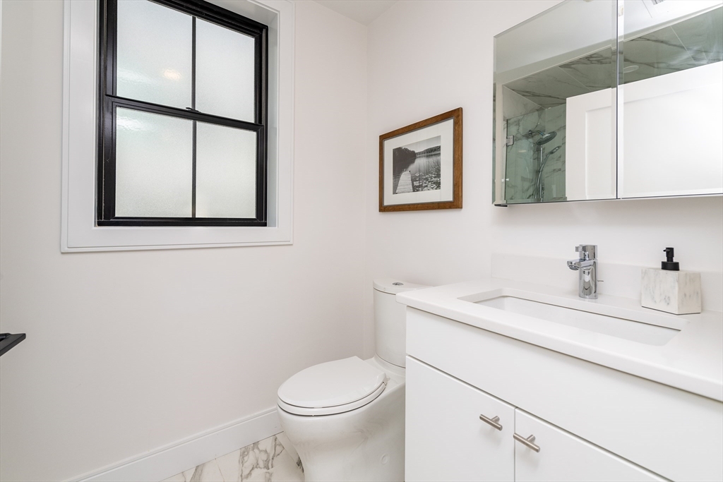 281 Lamartine Street Boston, MA 02130 - Photo 8 of 14 a bathroom with a sink a vanity and a toilet