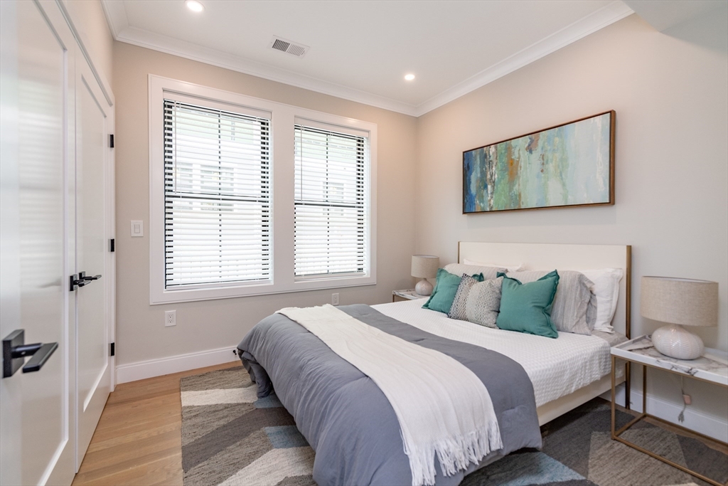 281 Lamartine Street Boston, MA 02130 - Photo 9 of 14 a bedroom with a large bed and a window
