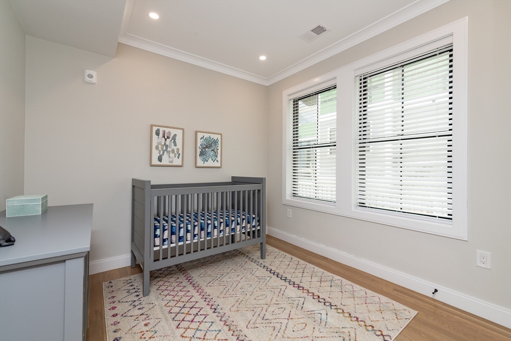 281 Lamartine Street Boston, MA 02130 - Photo 10 of 14 a bedroom with a bed and a window