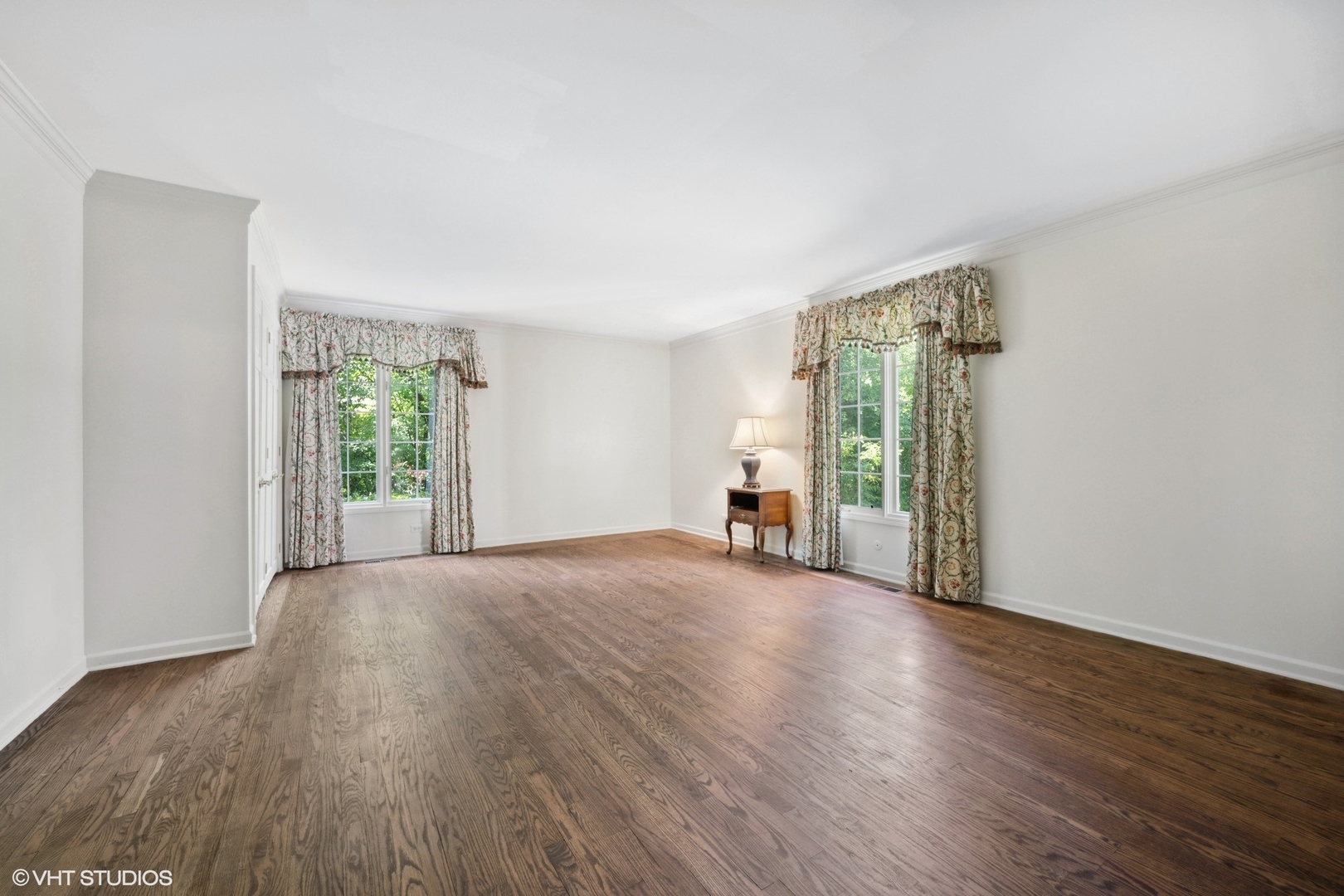 1100 Turicum Road Lake Forest, IL 60045 - Photo 18 of 38 an empty room with wooden floor and windows
