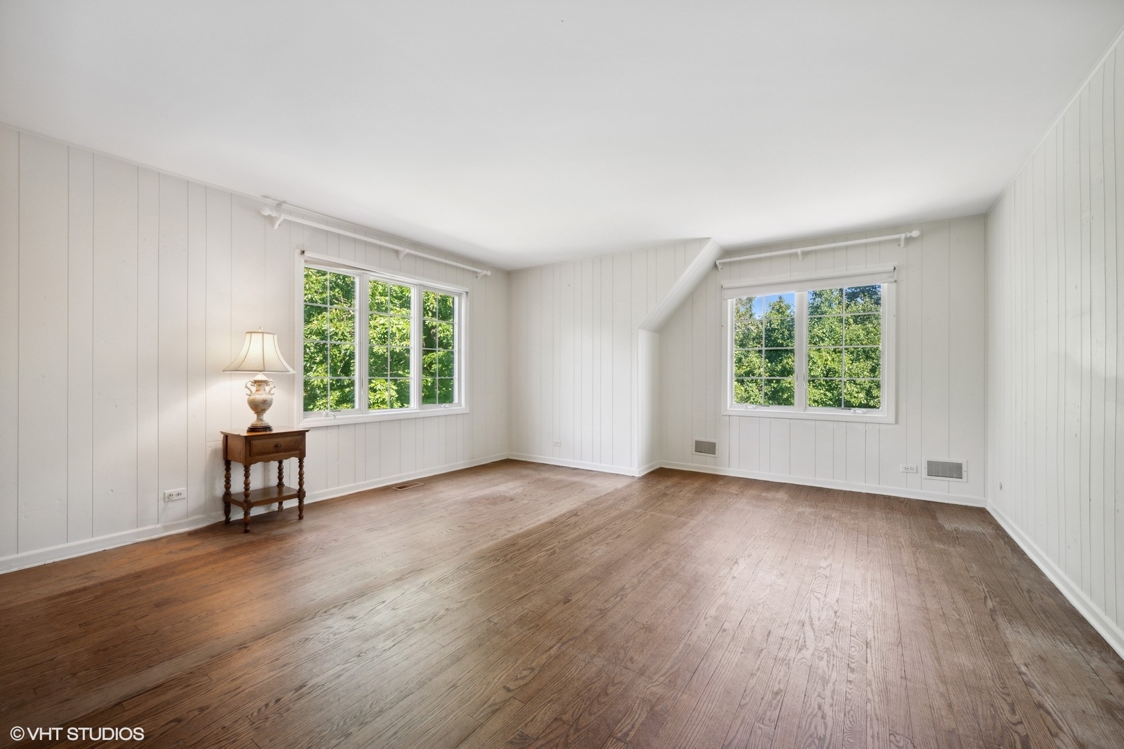 1100 Turicum Road Lake Forest, IL 60045 - Photo 22 of 38 an empty room with wooden floor and windows