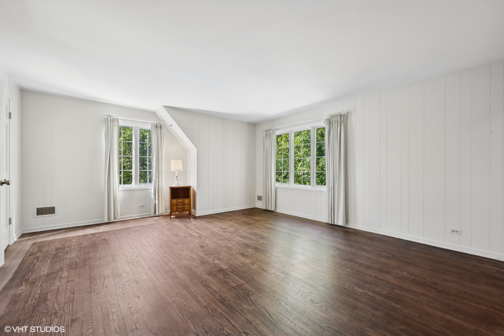 1100 Turicum Road Lake Forest, IL 60045 - Photo 26 of 38 an empty room with wooden floor and windows