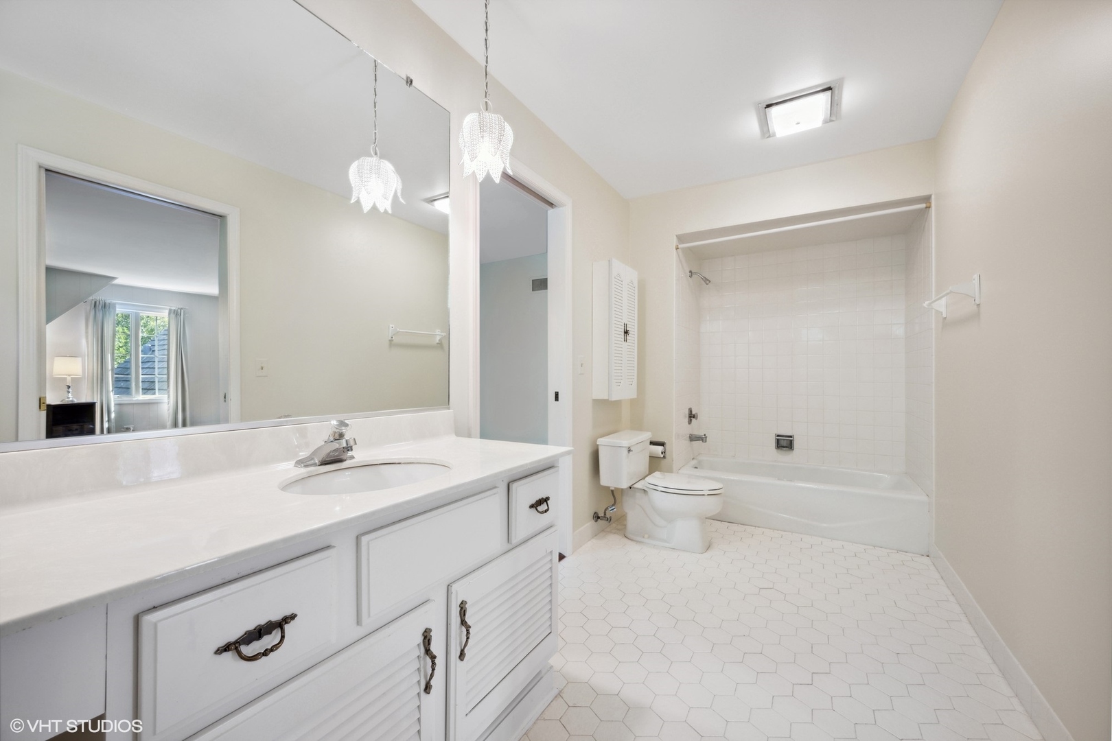 1100 Turicum Road Lake Forest, IL 60045 - Photo 27 of 38 a bathroom with a sink a toilet and a large mirror