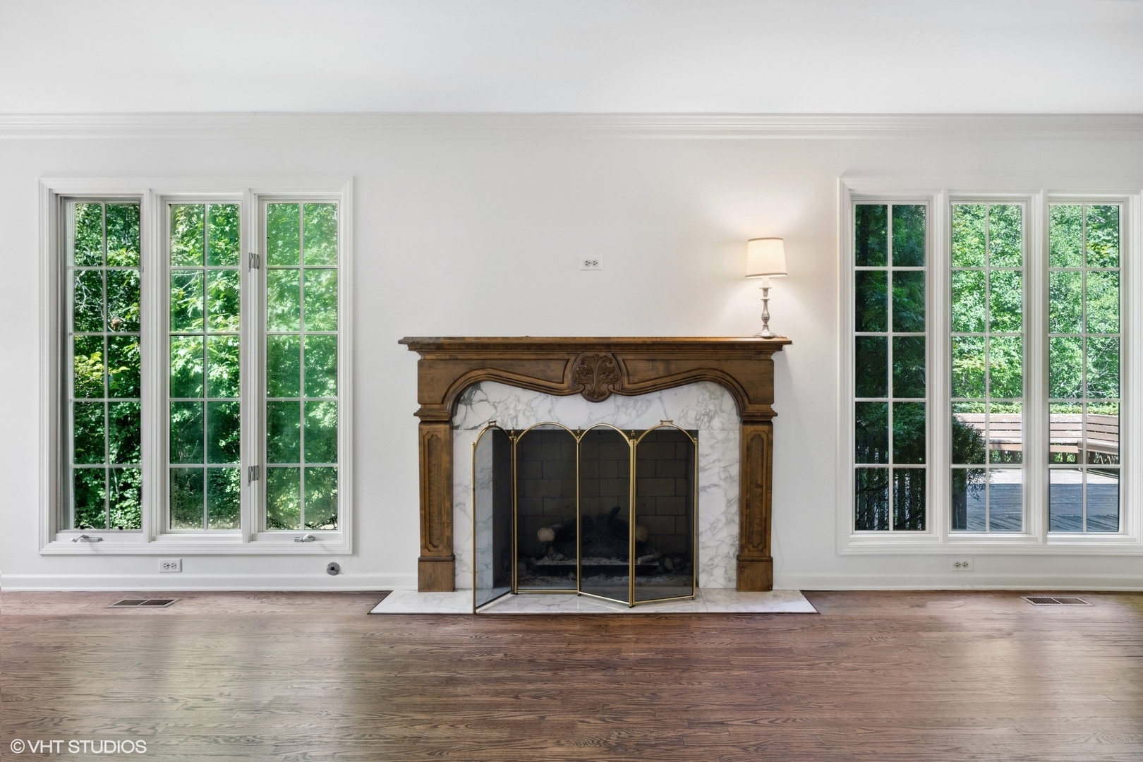 1100 Turicum Road Lake Forest, IL 60045 - Photo 6 of 38 a view of a fireplace with wooden floor
