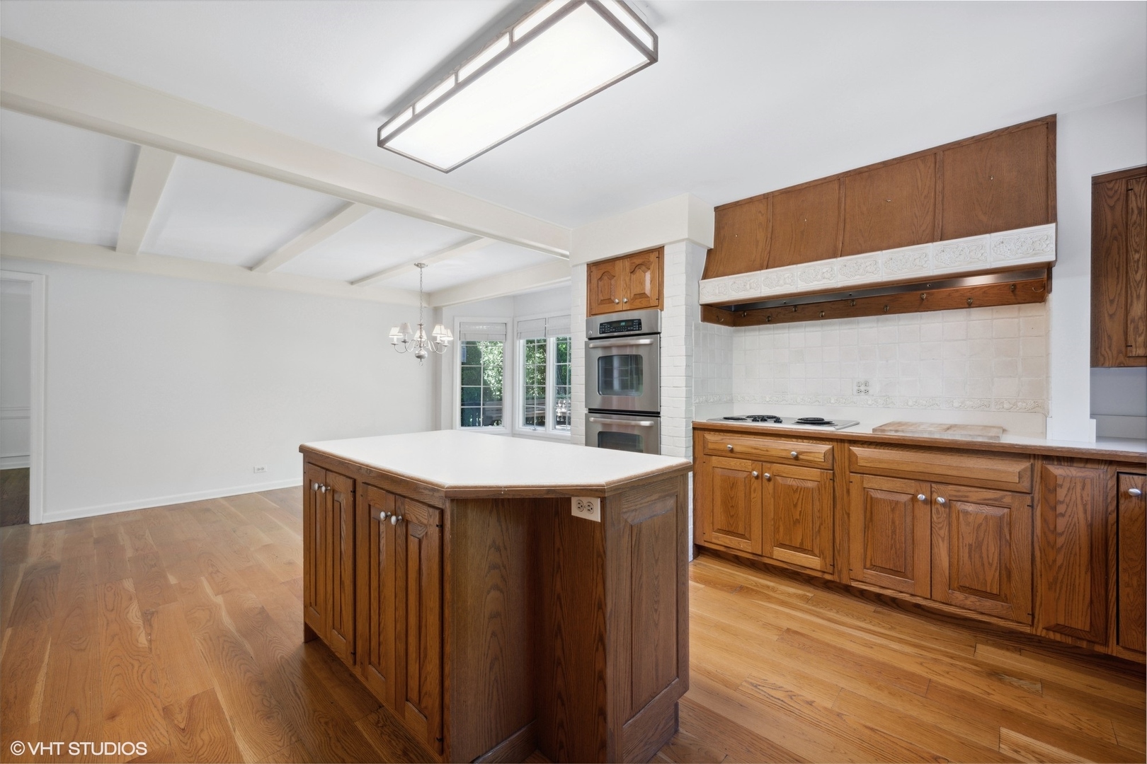 1100 Turicum Road Lake Forest, IL 60045 - Photo 9 of 38 a kitchen with stainless steel appliances granite countertop a sink and wooden cabinets with wooden floors