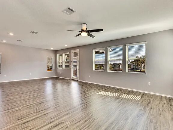 10403 Bramble Berry Drive Austin, TX 78748 - Photo 5 of 21 wooden floor in an empty room with a window
