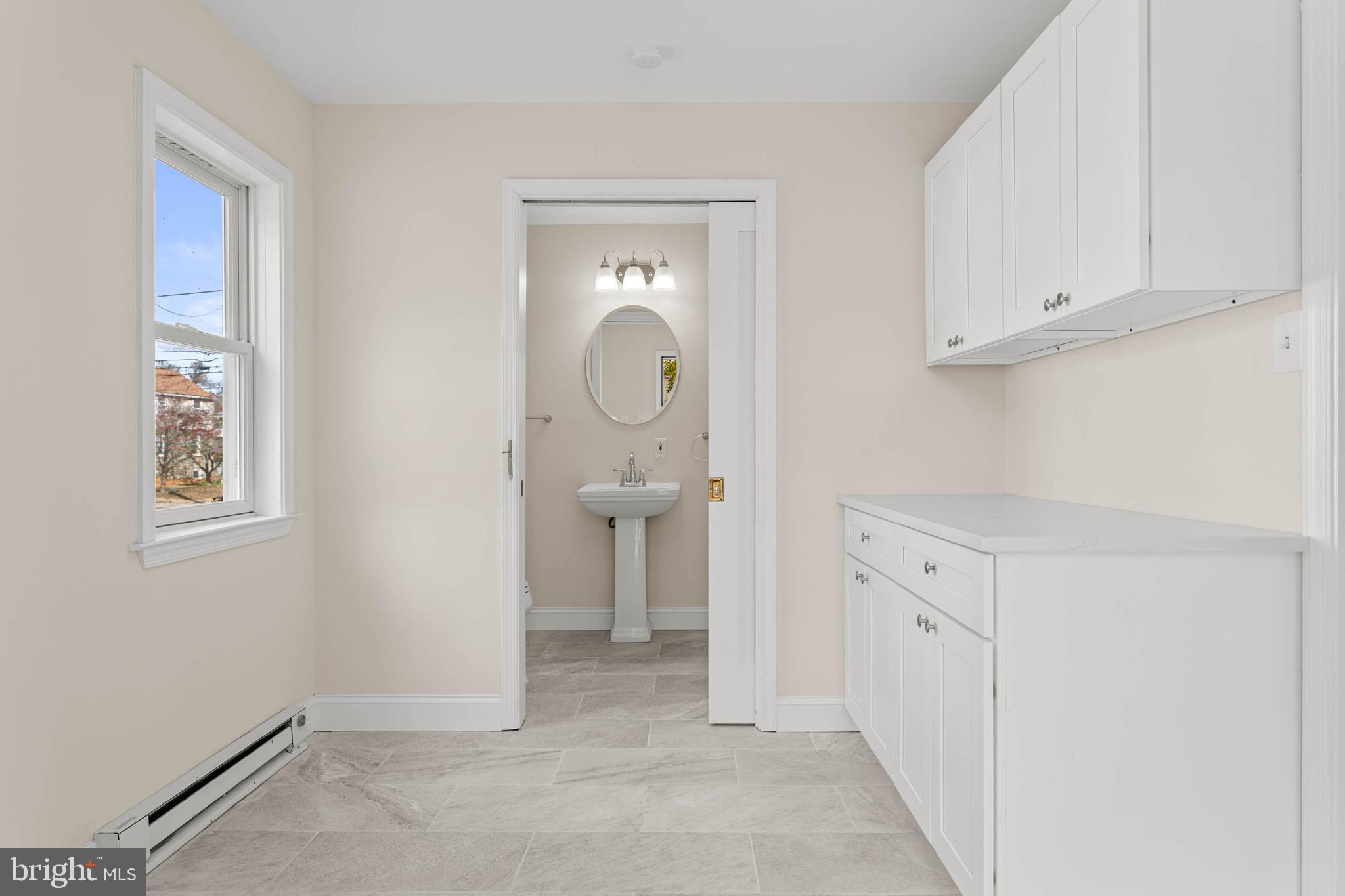 115 President Avenue Rutledge, PA 19070 - Photo 14 of 34 a view of a bathroom with sink mirror and window