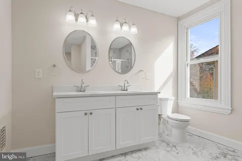 a bathroom with a shower and a sink