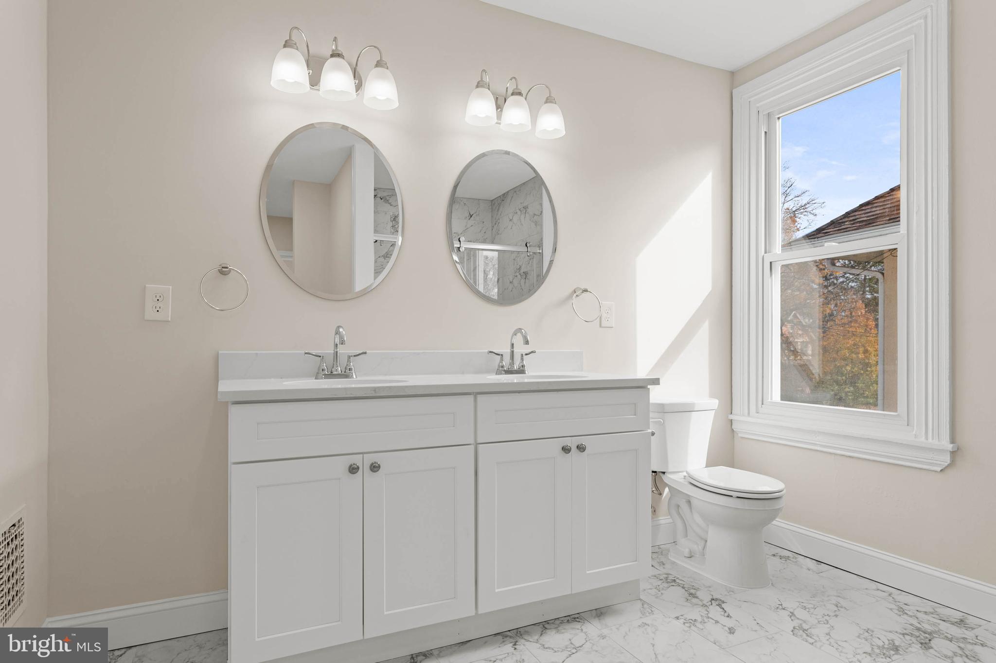 115 President Avenue Rutledge, PA 19070 - Photo 18 of 34 a bathroom with a toilet a sink and a mirror