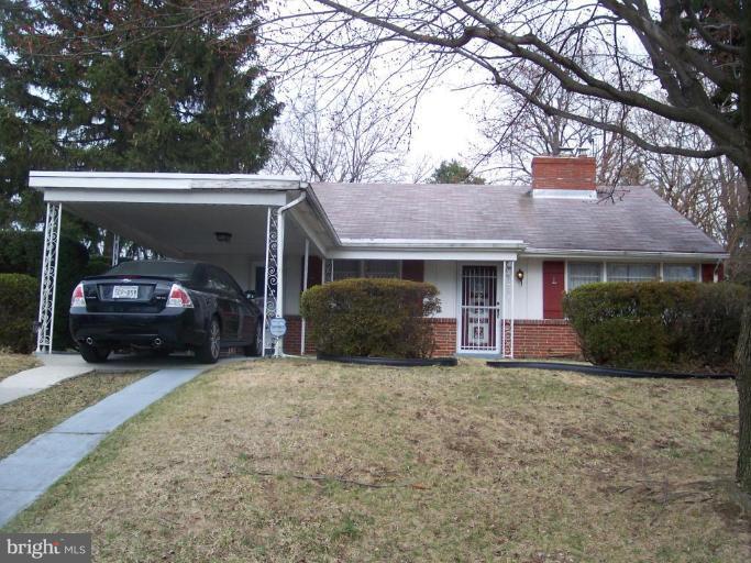 1403 Shefford Road Baltimore, MD 21239 - Photo 1 of 3 a view of a car in front of house
