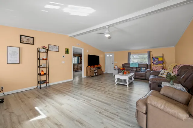 a living room with furniture and view of living room