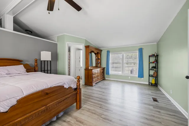 a bed room with a bed and a window