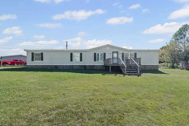a front view of a house with stairs