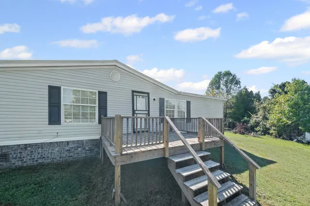 an aerial view of a house with a garden