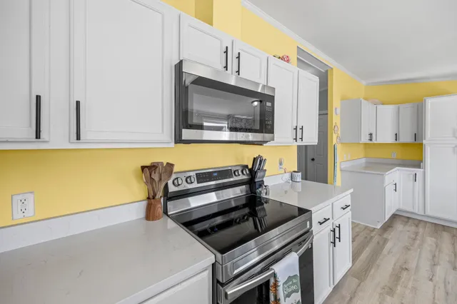 a kitchen with a stove and a microwave