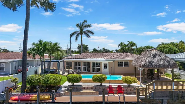 a view of a patio with swimming pool table and chairs