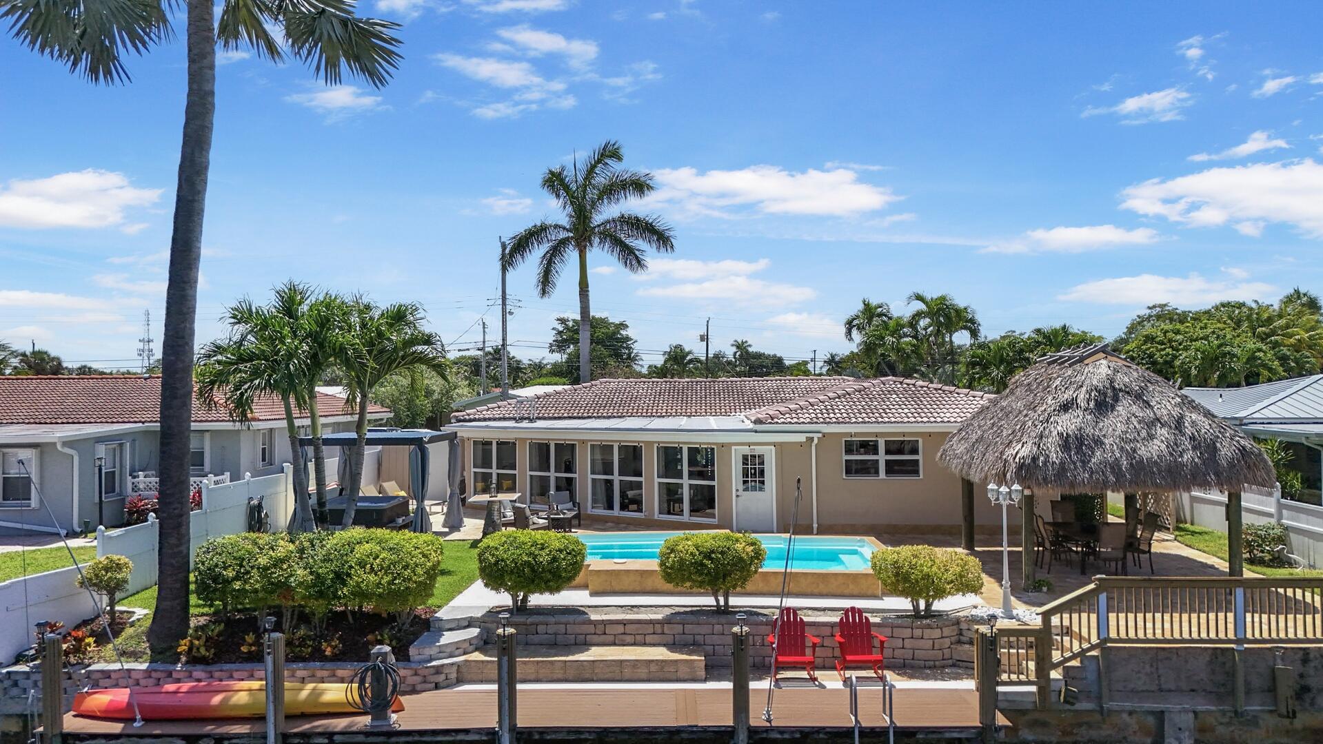a view of a patio with swimming pool table and chairs