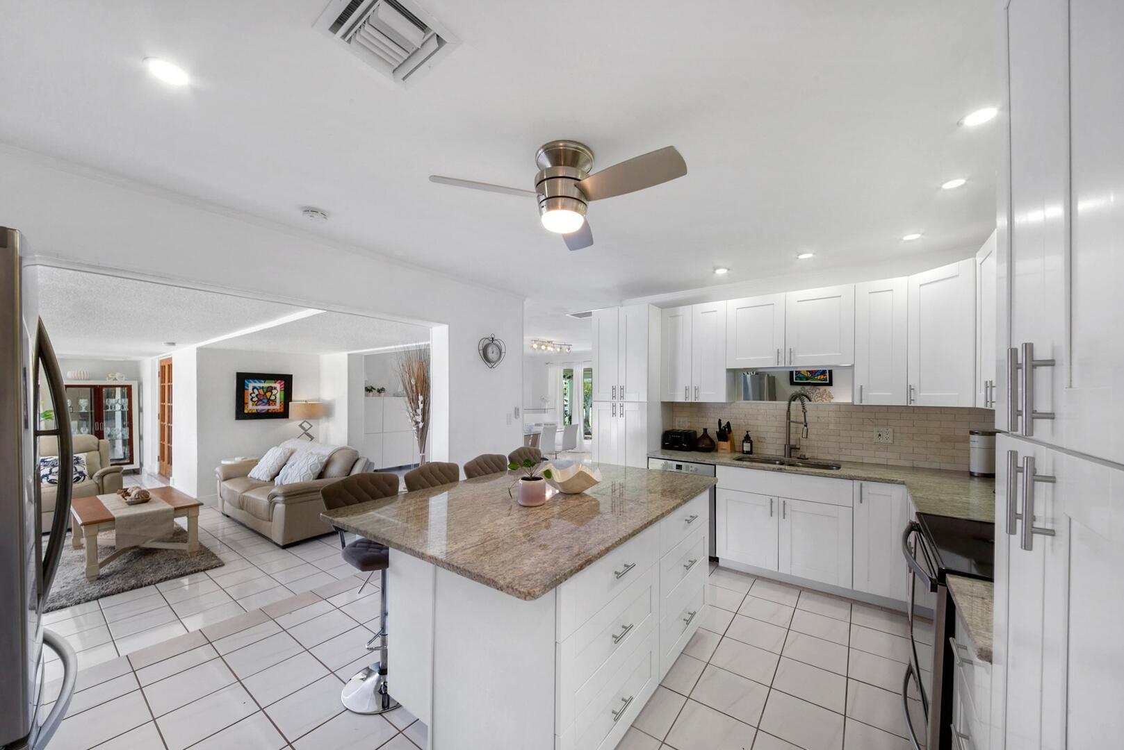 220 Southeast 2nd Avenue Pompano Beach, FL 33060 - Photo 43 of 43 a kitchen with stainless steel appliances granite countertop a sink and cabinets