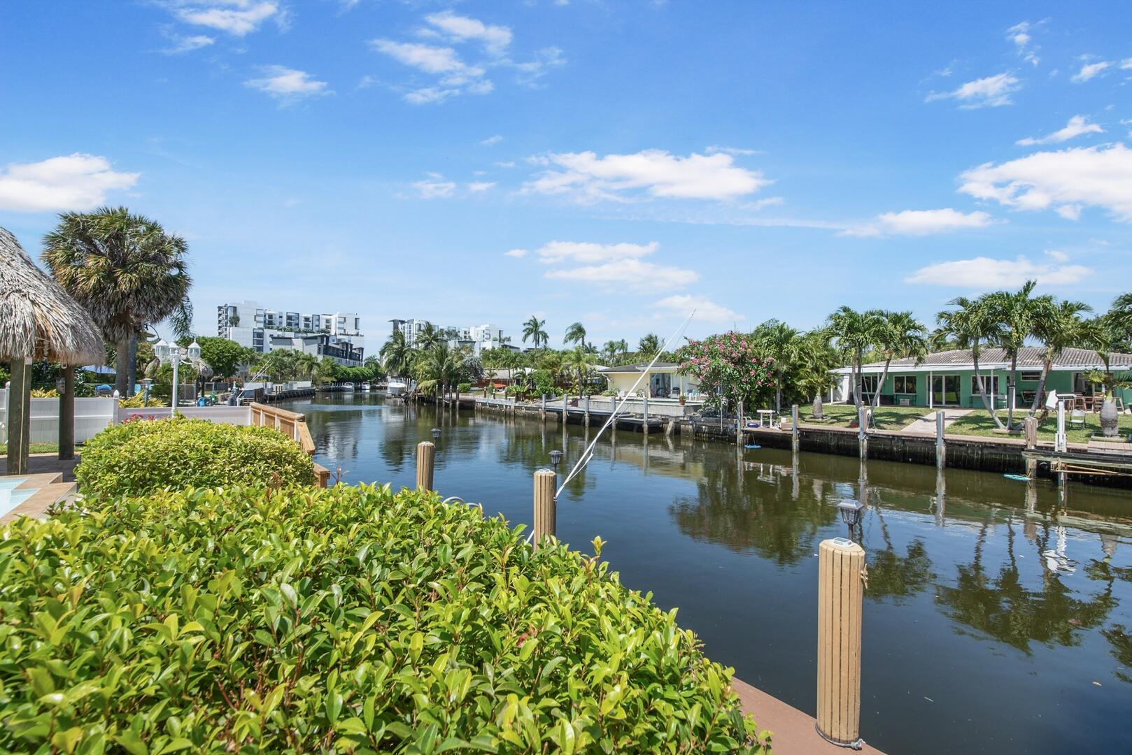 220 Southeast 2nd Avenue Pompano Beach, FL 33060 - Photo 2 of 43 a view of a lake with houses in the back