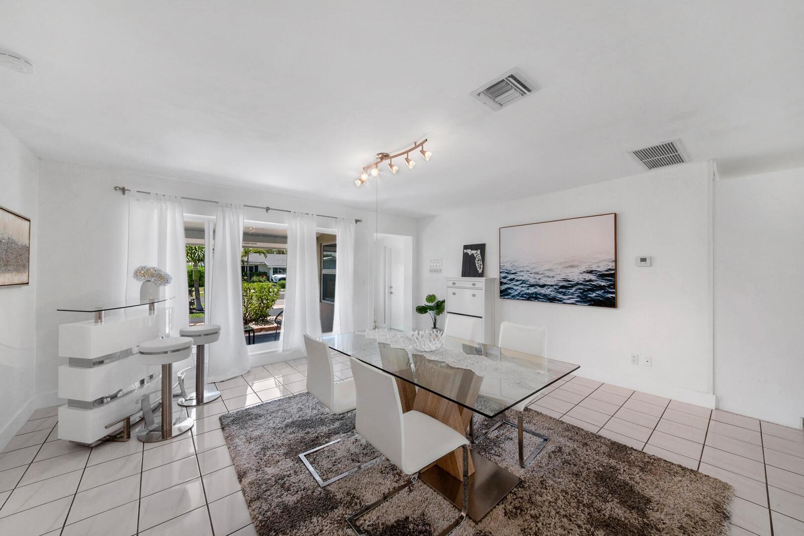 220 Southeast 2nd Avenue Pompano Beach, FL 33060 - Photo 5 of 43 a living room with furniture and a table