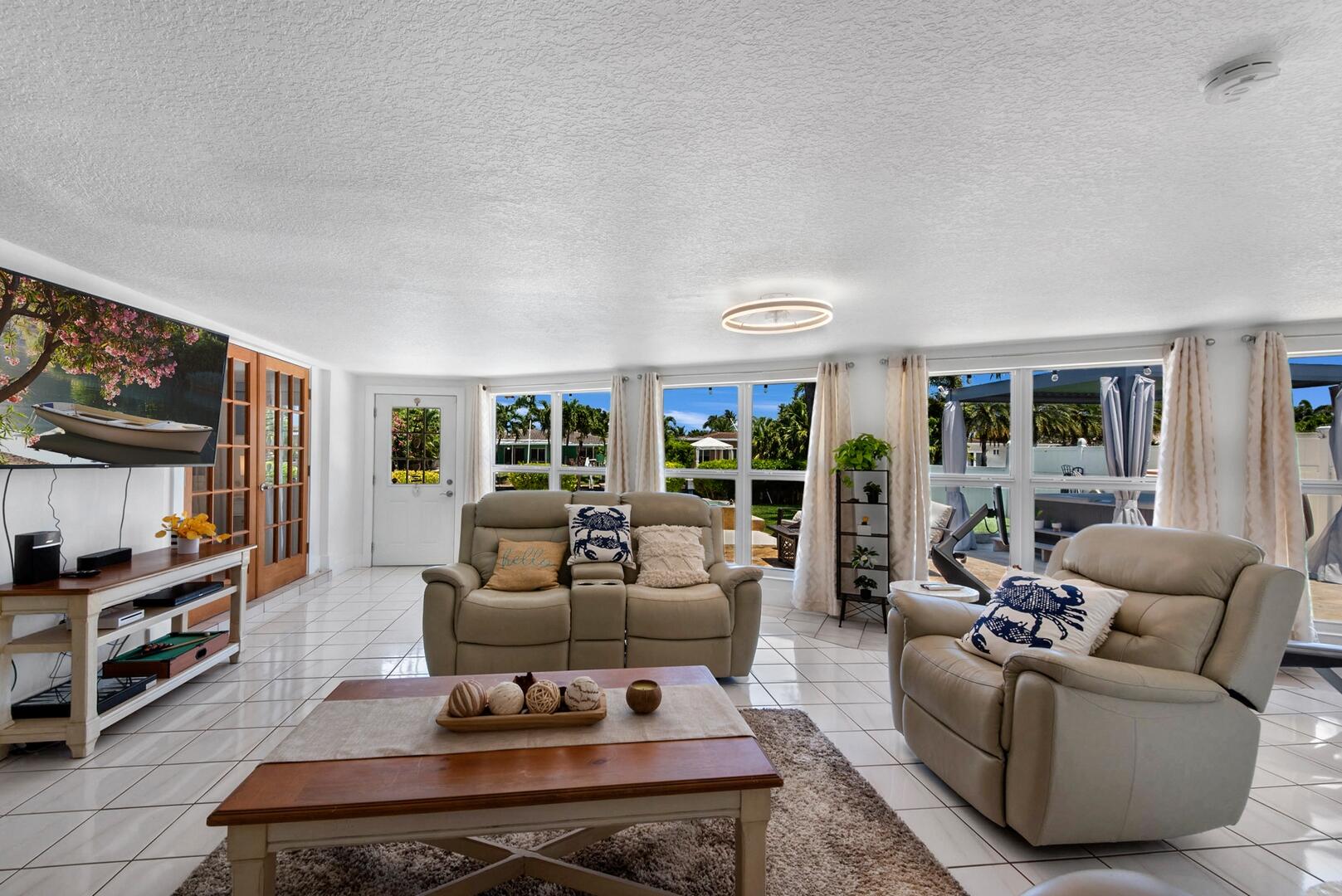 220 Southeast 2nd Avenue Pompano Beach, FL 33060 - Photo 7 of 43 a living room with furniture and a flat screen tv