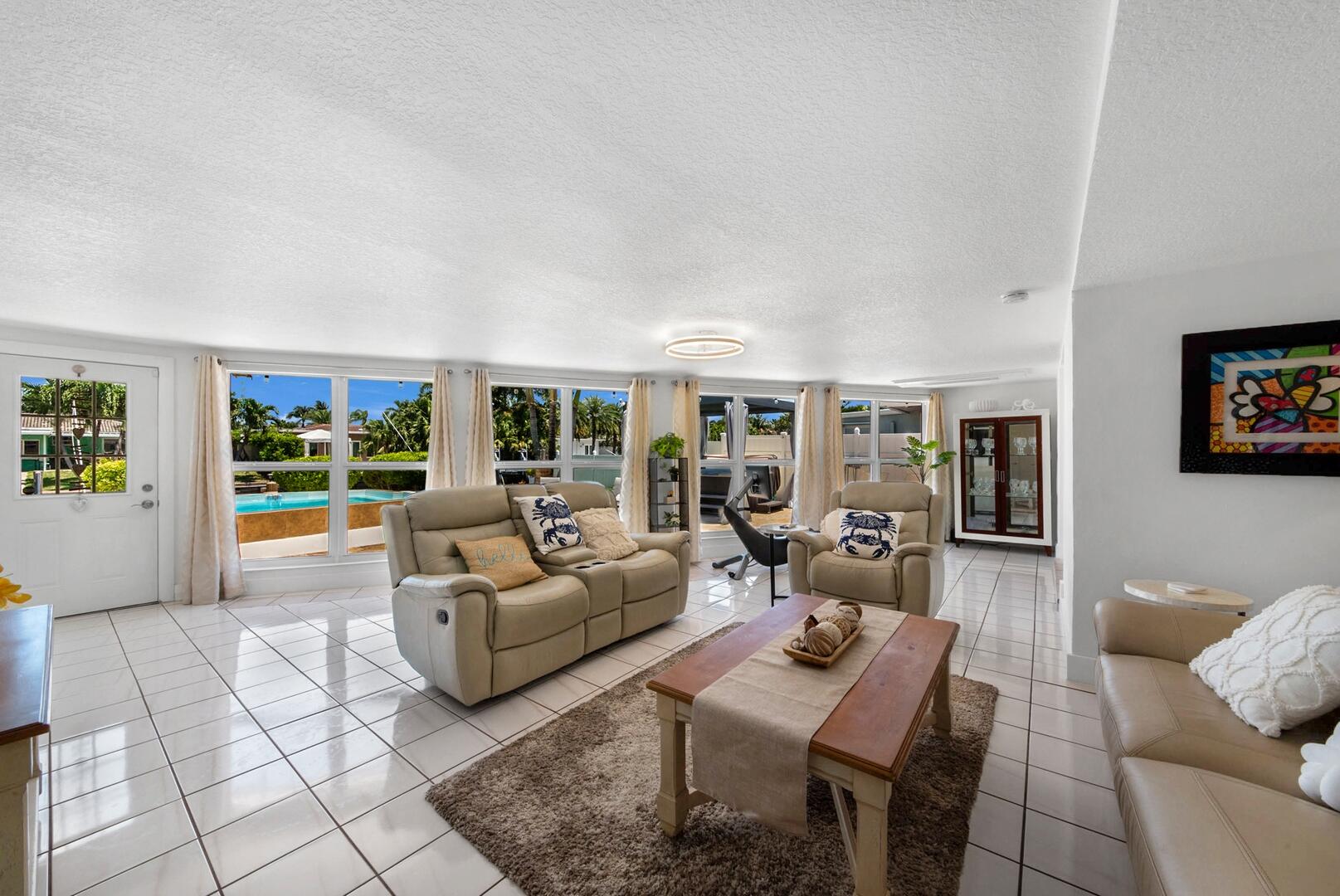 220 Southeast 2nd Avenue Pompano Beach, FL 33060 - Photo 8 of 43 a living room with furniture and a large window
