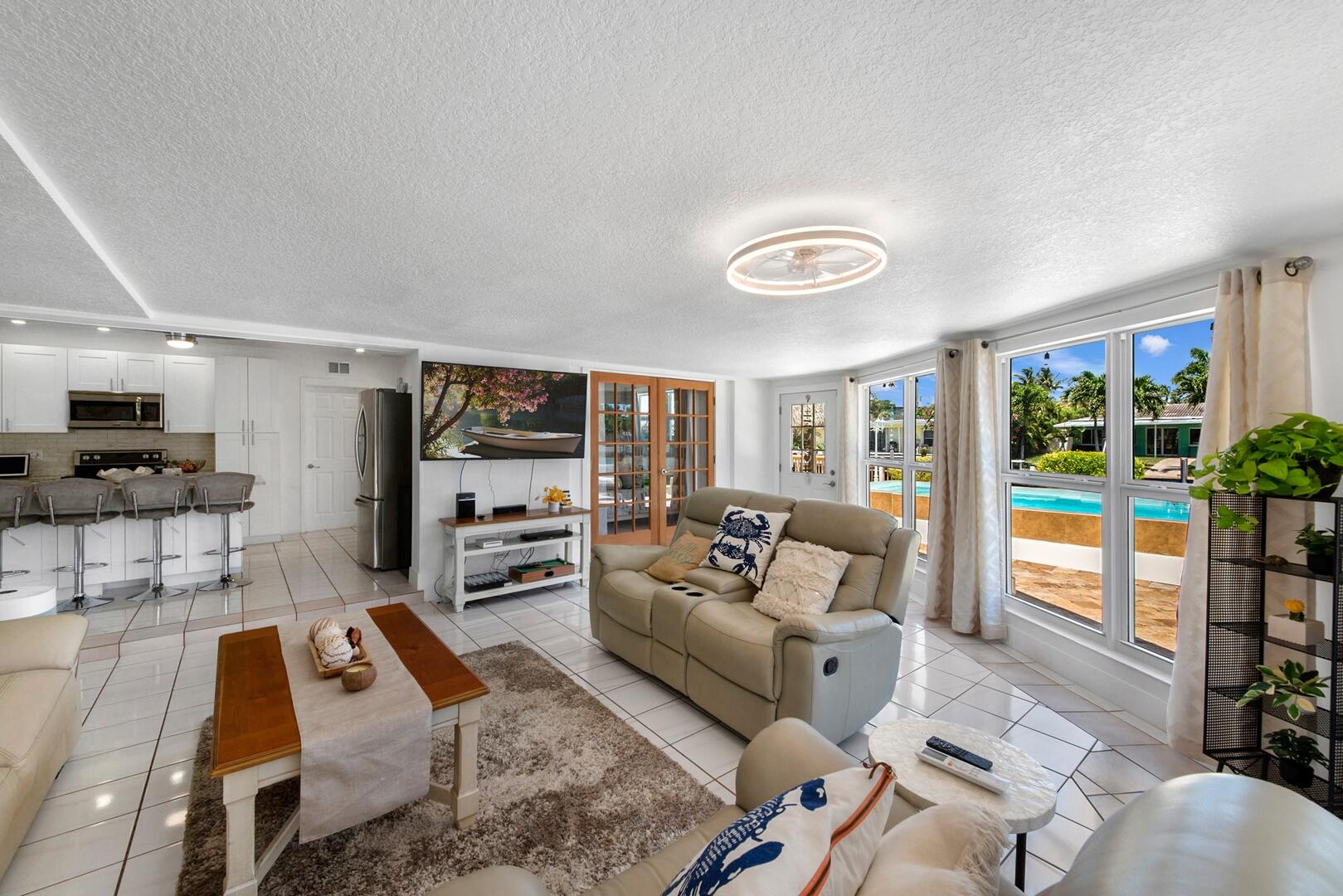 220 Southeast 2nd Avenue Pompano Beach, FL 33060 - Photo 42 of 43 a living room with furniture and a flat screen tv