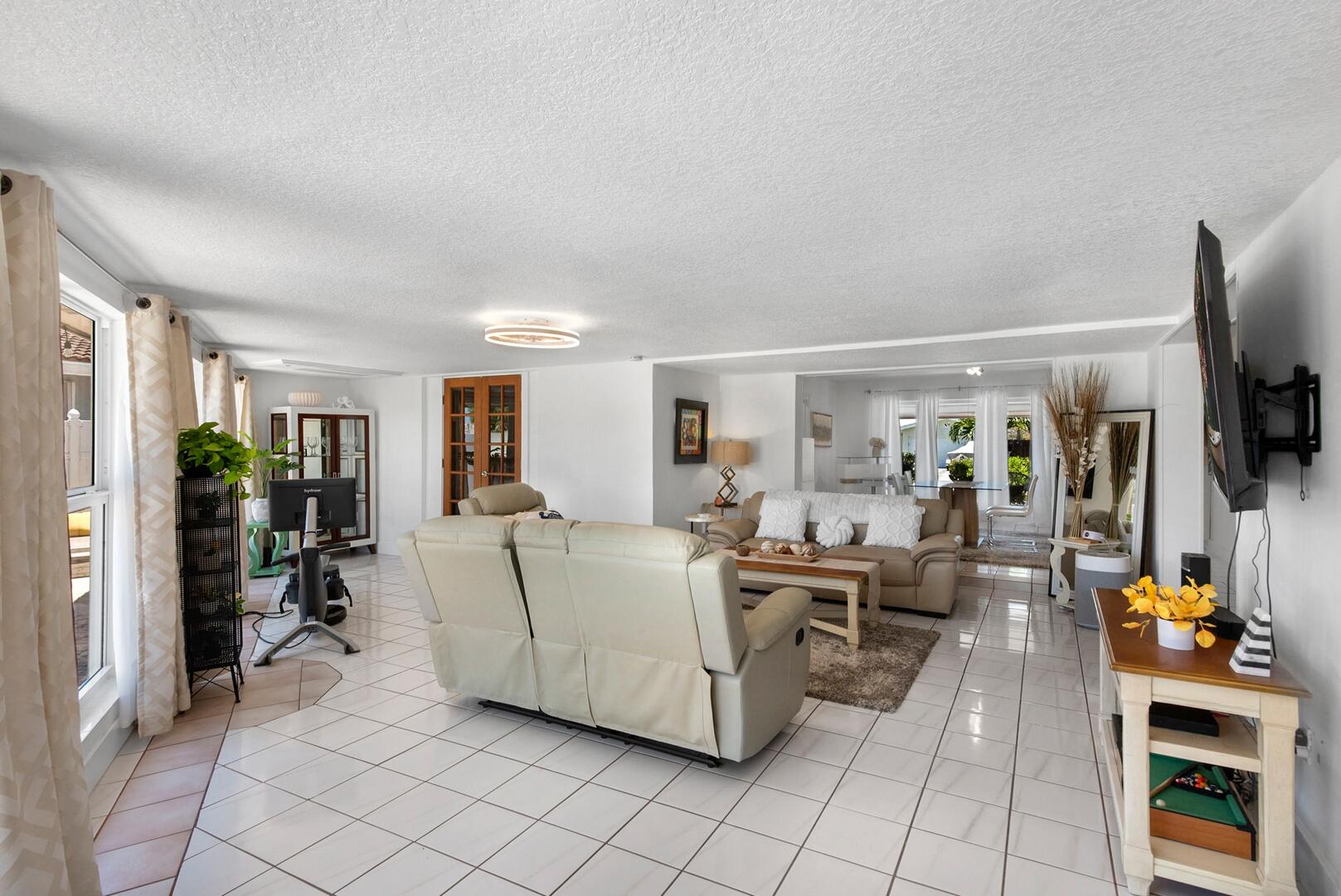 220 Southeast 2nd Avenue Pompano Beach, FL 33060 - Photo 9 of 43 a living room with furniture and a flat screen tv