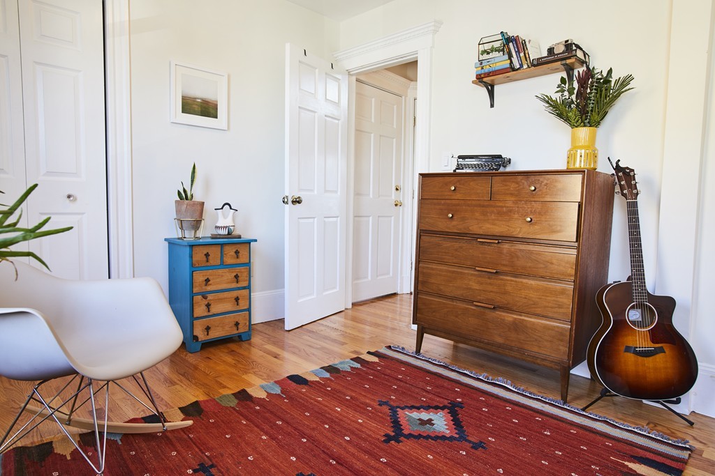 56 Hinckley Street, Unit 2 Somerville, MA 02145 - Photo 4 of 18 a room with wooden floor and furniture