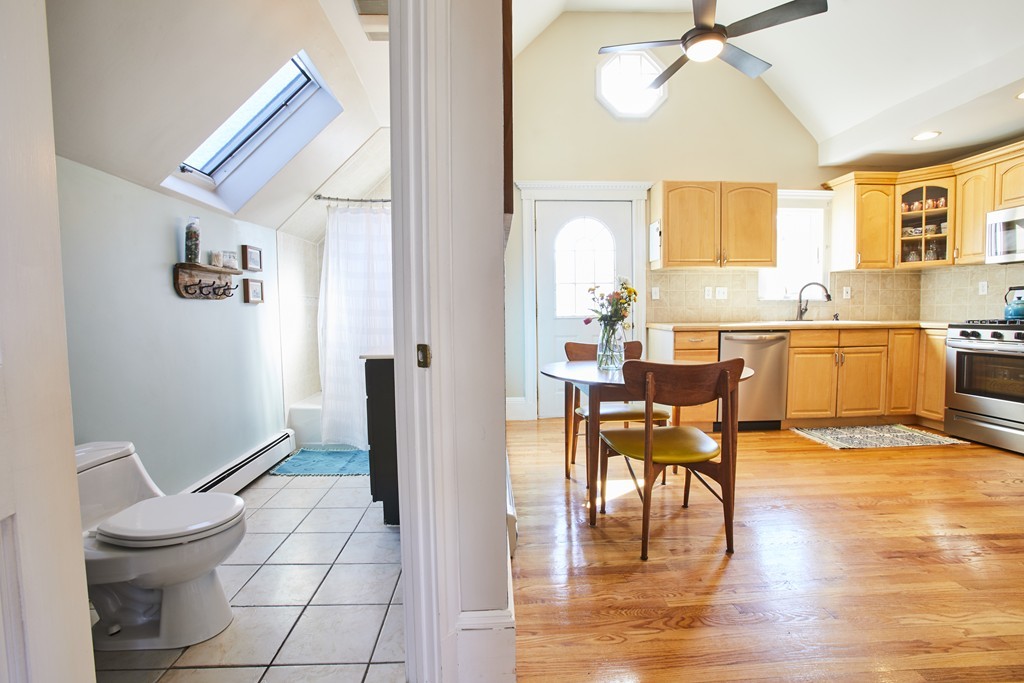 56 Hinckley Street, Unit 2 Somerville, MA 02145 - Photo 9 of 18 a view of a dining room with furniture and wooden floor