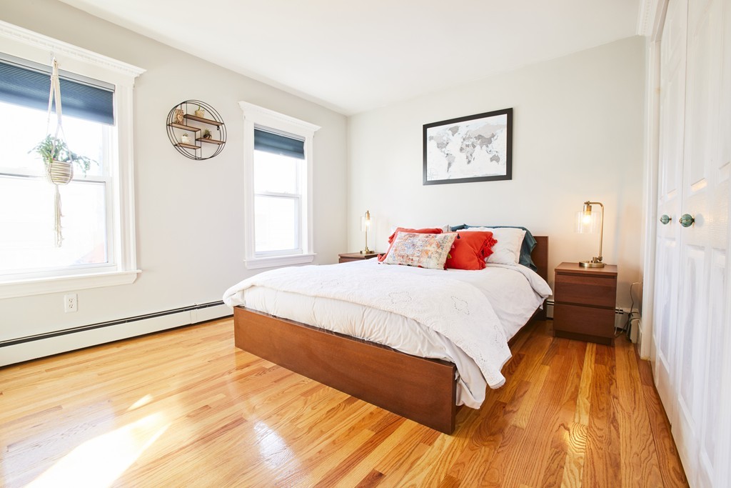 56 Hinckley Street, Unit 2 Somerville, MA 02145 - Photo 10 of 18 a bedroom with a bed and a window
