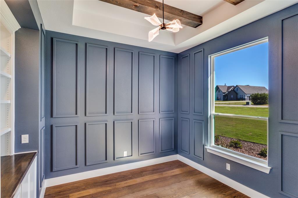 555 Aermotor Loop Weatherford, TX 76085 - Photo 16 of 30 a view of empty room with wooden floor and fan