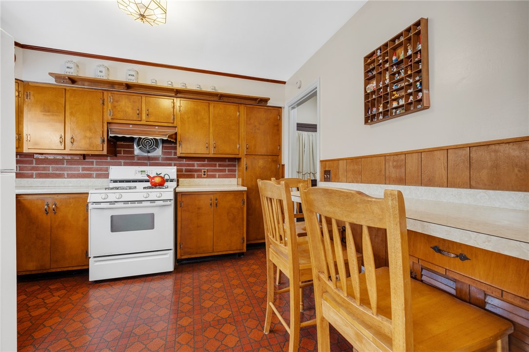 97 Vinton Road Irondequoit, NY 14622 - Photo 13 of 49 BEAUTIFUL BIRCH CABINETRY WITH BREAKFAST BAR