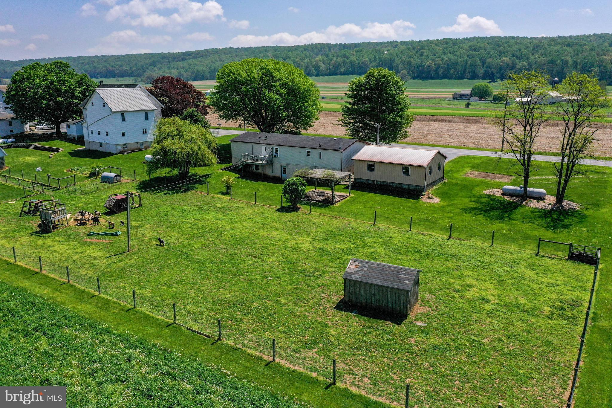 494 Compass Road Gap, PA 17527 - Photo 11 of 127 an aerial view of a house with garden space and street view
